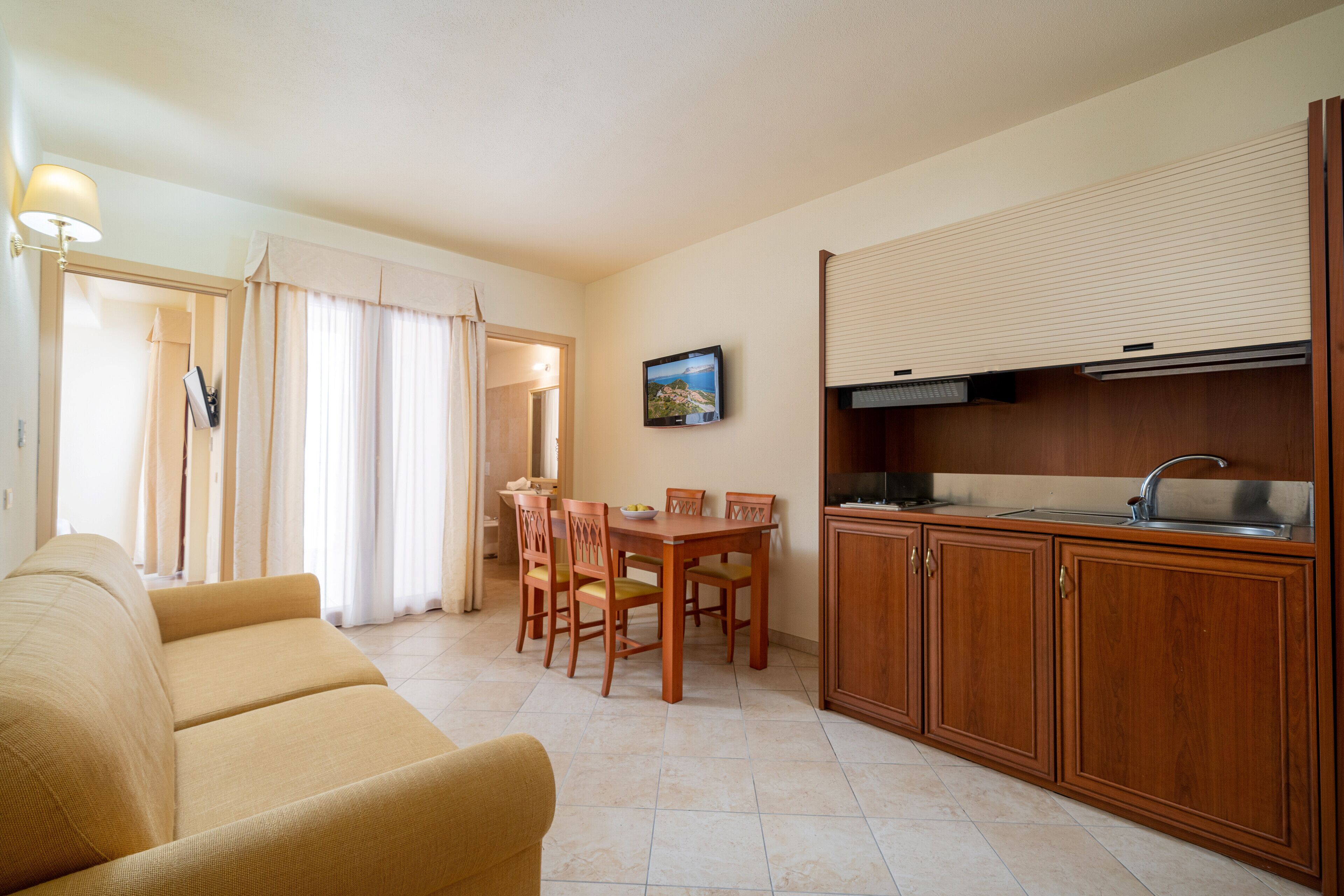 deluxe room | living area | 32-inch lcd tv with digital channels, tv
