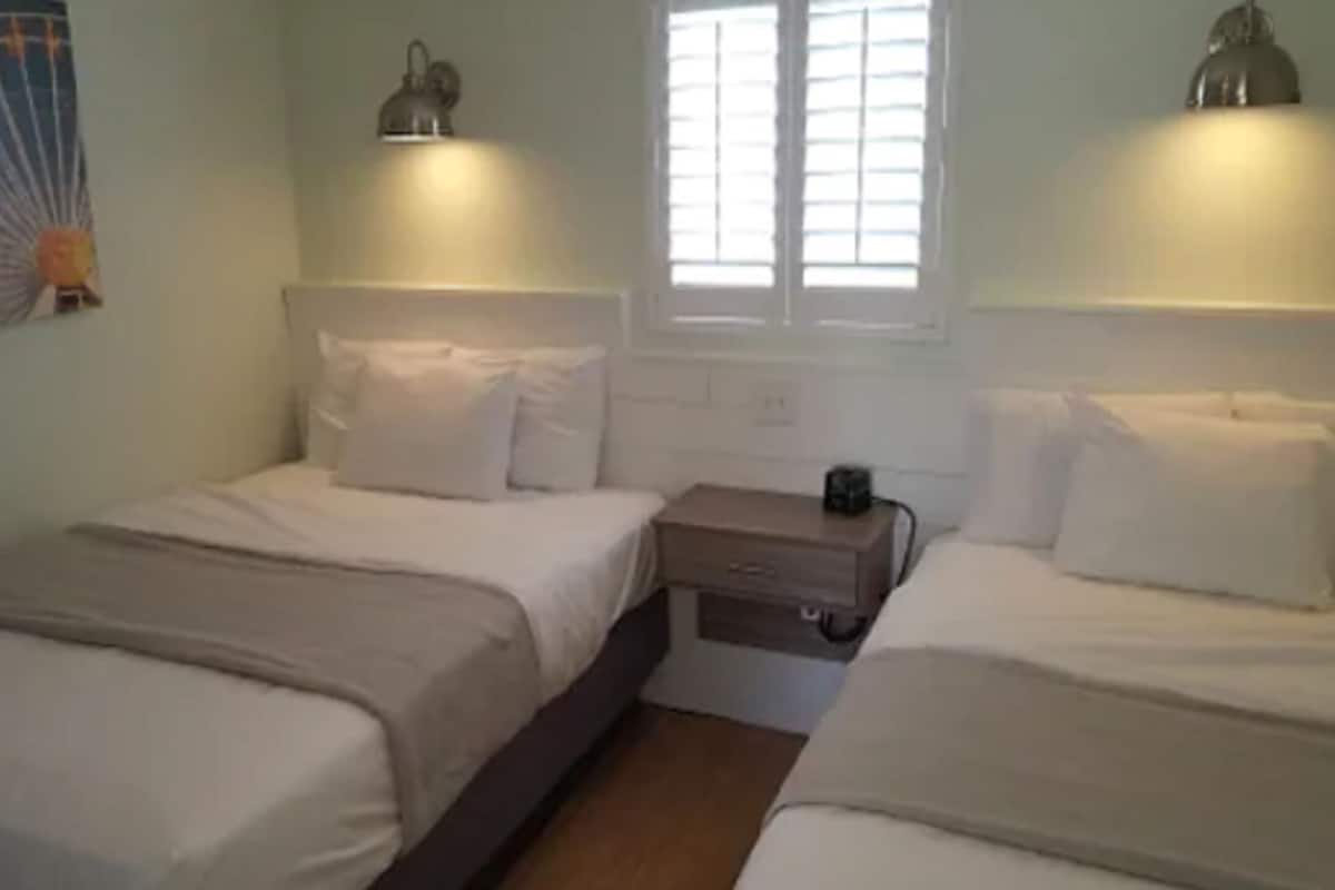 family suite, 1 bedroom, kitchenette, partial ocean view | free wifi, bed sheets