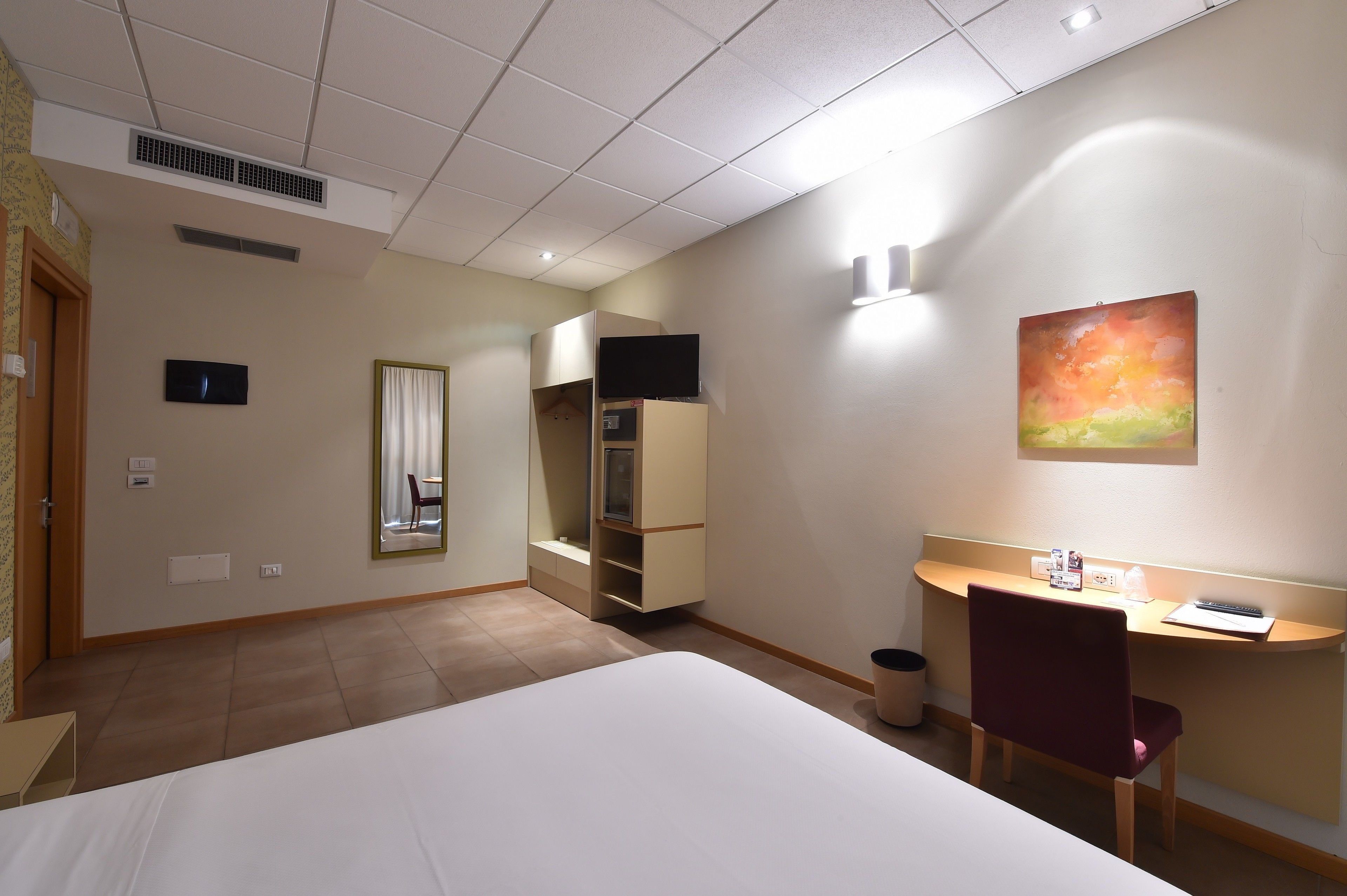 family room | minibar, in-room safe, desk, blackout curtains