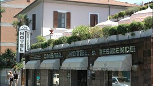 A hotel with a sign reading "Crystal Hotel & Residence" and multiple units with awnings. - Hotel Crystal & Residence (Portoferraio)