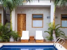 Outdoor pool, open 8:00 AM to 8:00 PM, pool umbrellas, sun loungers