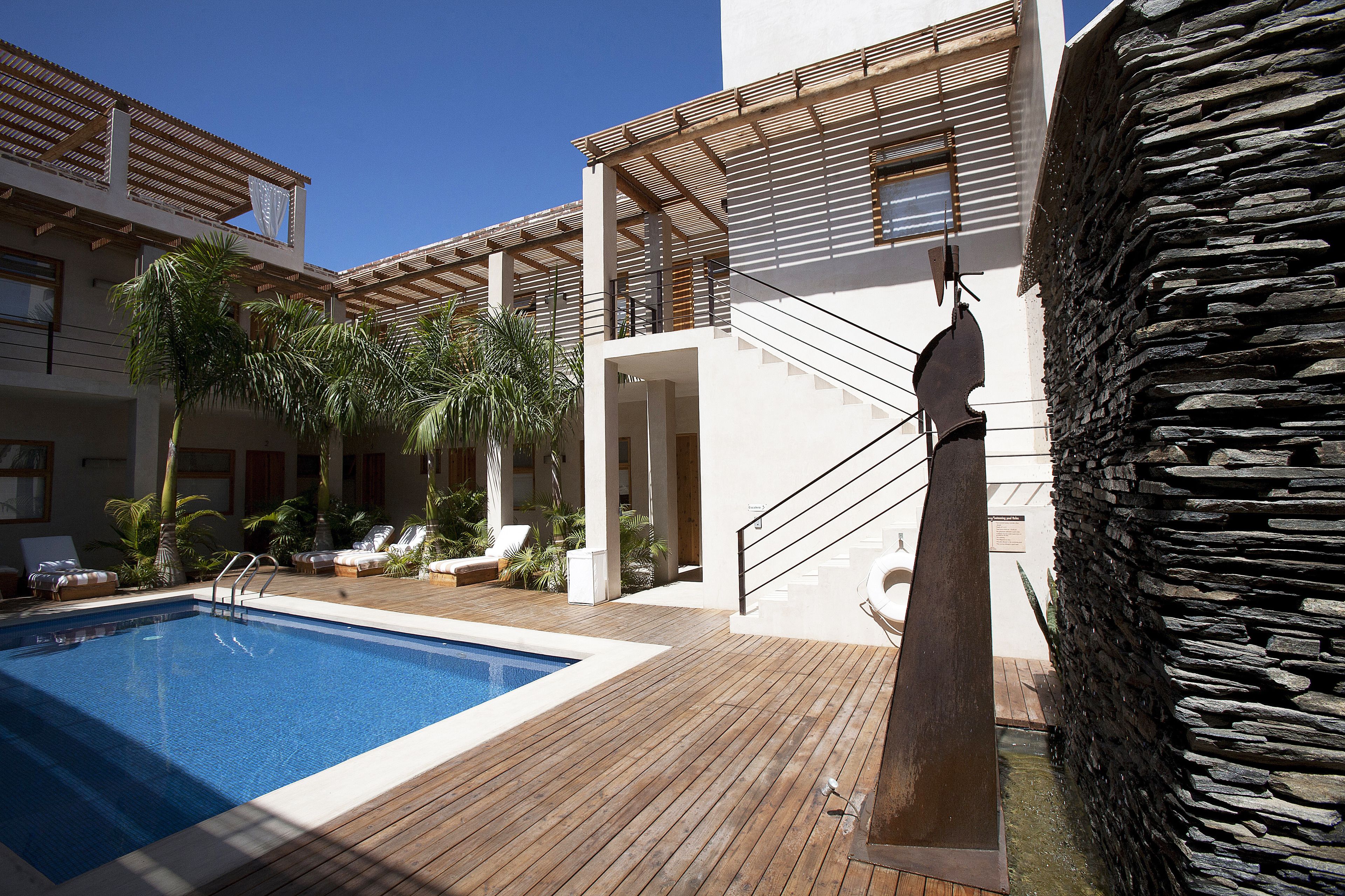 outdoor pool, open 8:00 am to 8:00 pm, pool umbrellas, pool loungers