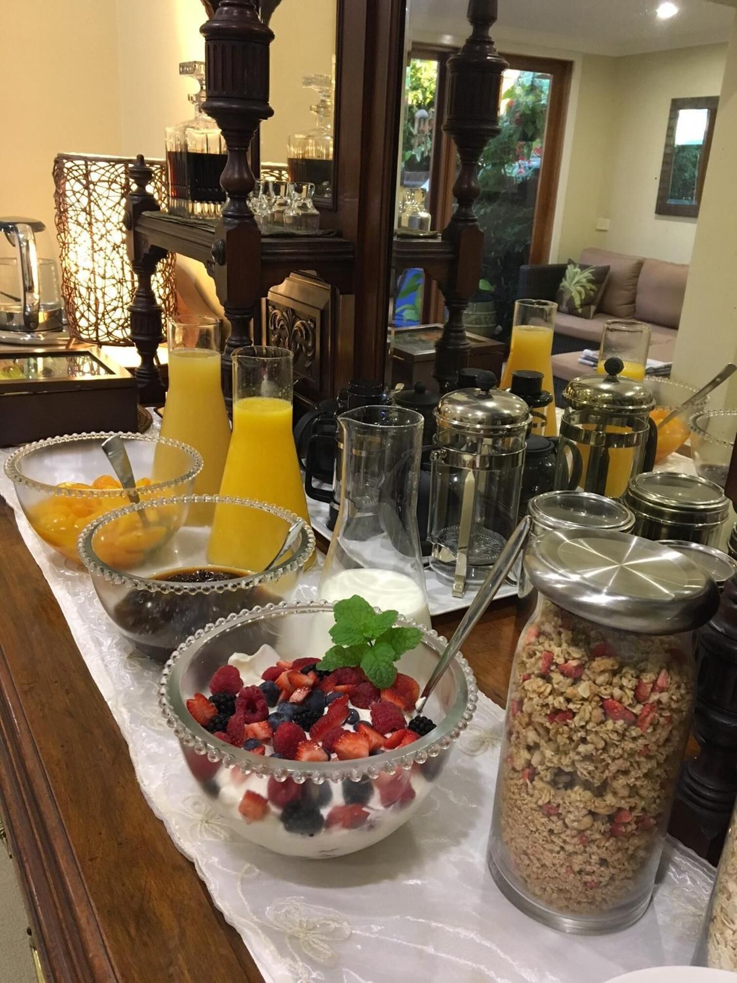 A breakfast buffet with various food items and beverages.