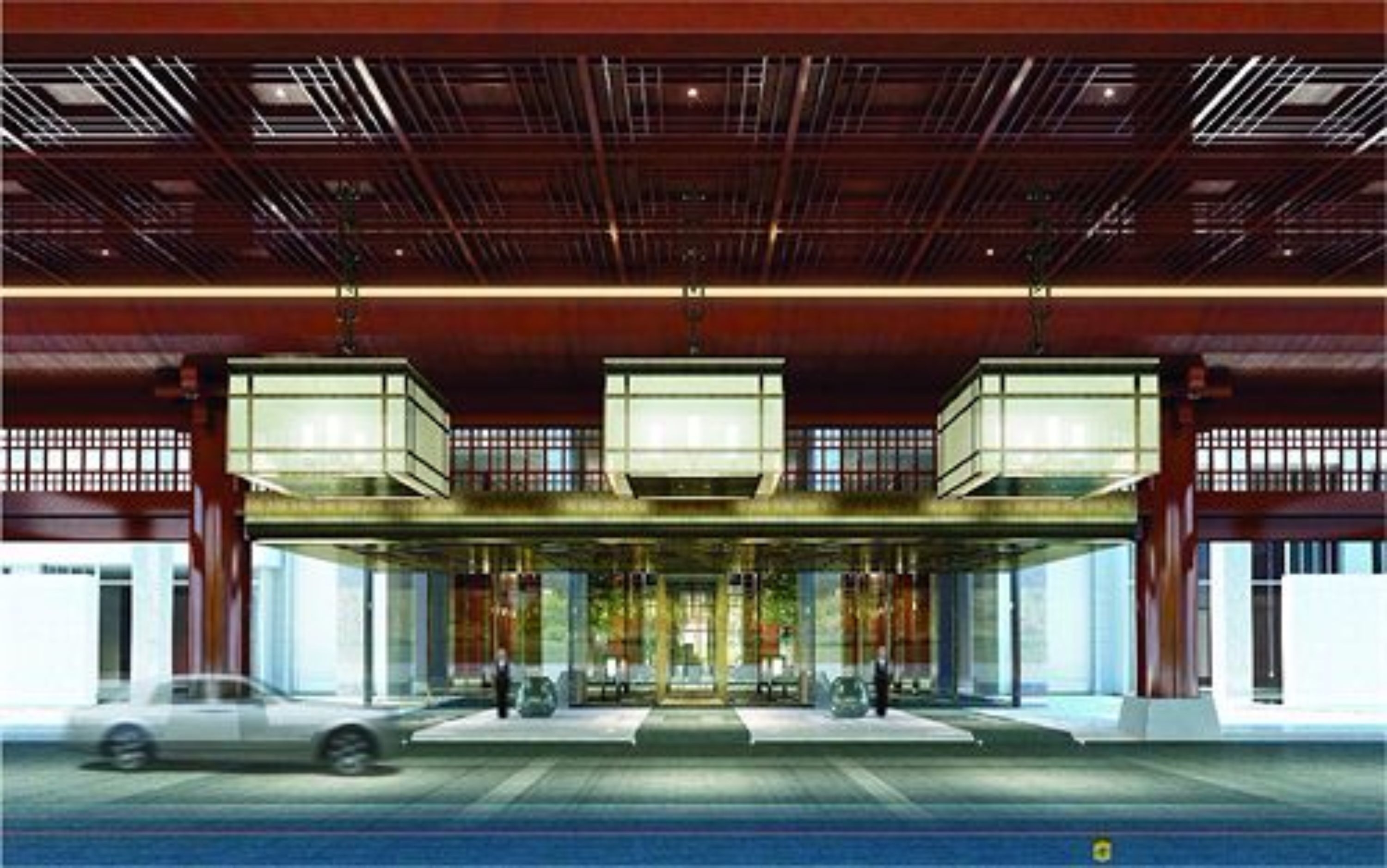 Un edificio moderno con una entrada amplia, múltiples puertas de cristal y un techo de estructura metálica.
