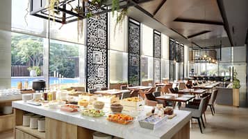 Breakfast, lunch, dinner served; international cuisine, pool views