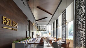 A modern bistro with a wooden wall, seating area, and patterned decor. - Fraser Residence Menteng Jakarta (Jakarta)