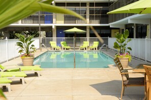 Seasonal outdoor pool, open 9:00 AM to 9:00 PM, pool umbrellas