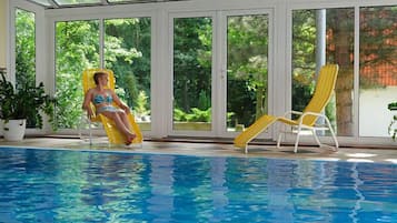 Indoor pool, pool umbrellas, sun loungers