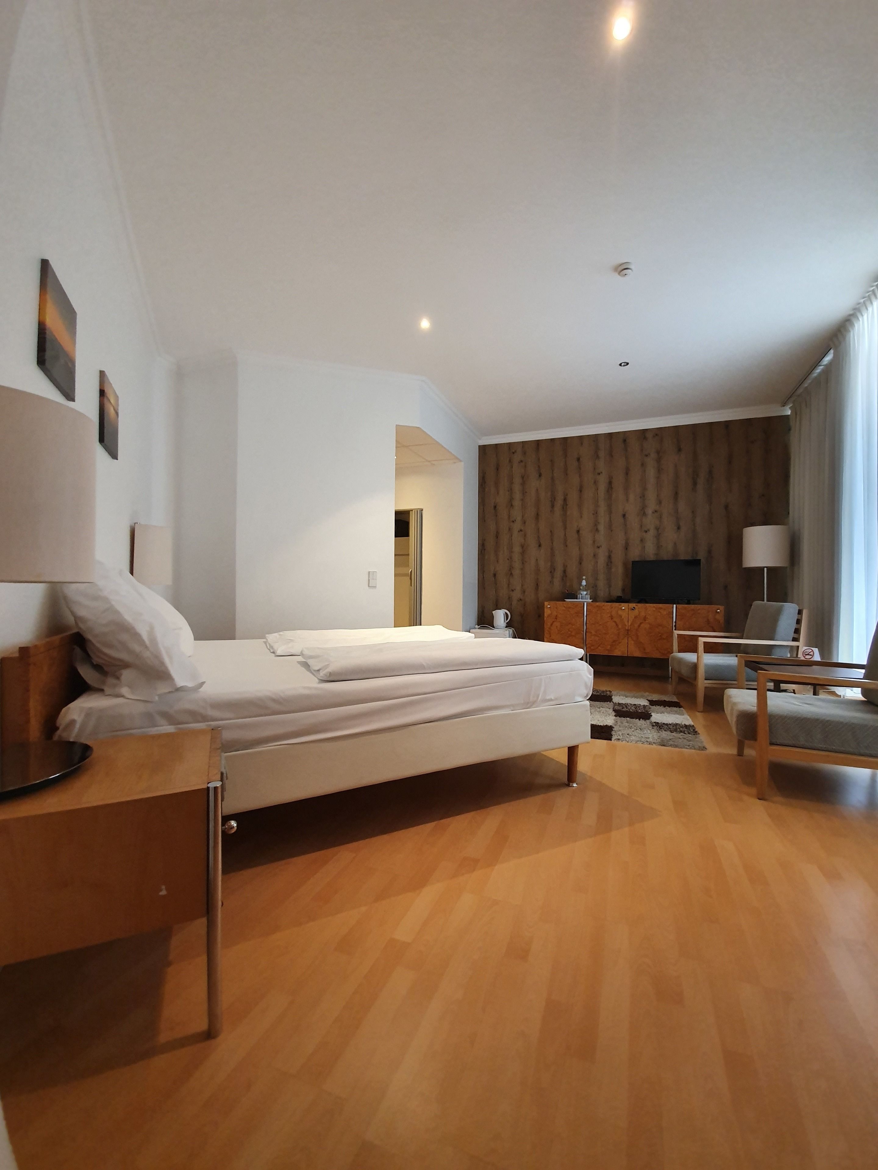 comfort double room | living area | flat-screen tv