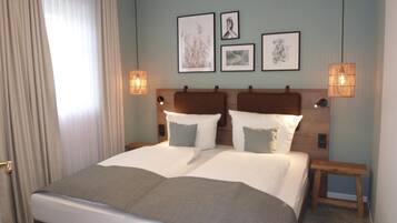 Een minibar, een kluis op de kamer, een bureau, gratis wifi