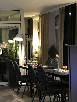 Enjoy meals in this stylish dining area with a large table and comfortable seating for four.