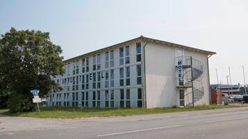 A building with a sign that reads "Motel."