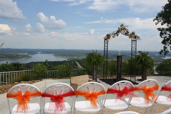 Outdoor seating with a view of a lake and mountains. - Whitney Mountain Lodge (Garfield)