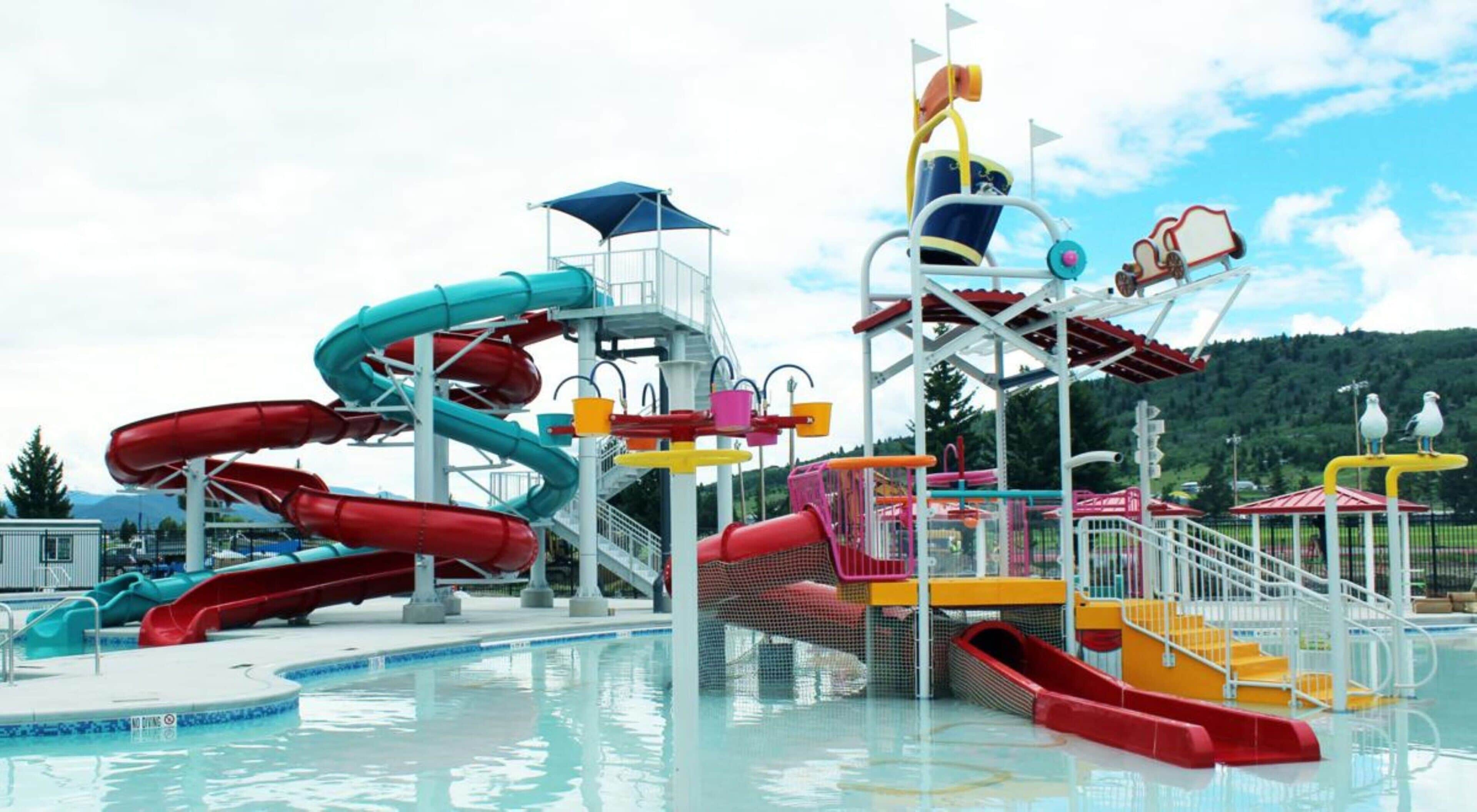 A water park with multiple slides and a pool area.