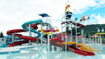 A water park with multiple slides and a pool area.
