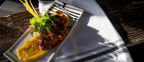 A rectangular white plate with a striped napkin underneath.