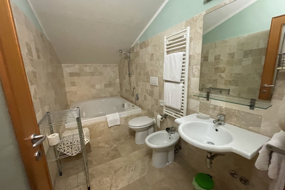 family room | bathroom | hair dryer, bidet, towels