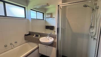 Separate bathtub and shower, free toiletries, hair dryer, towels