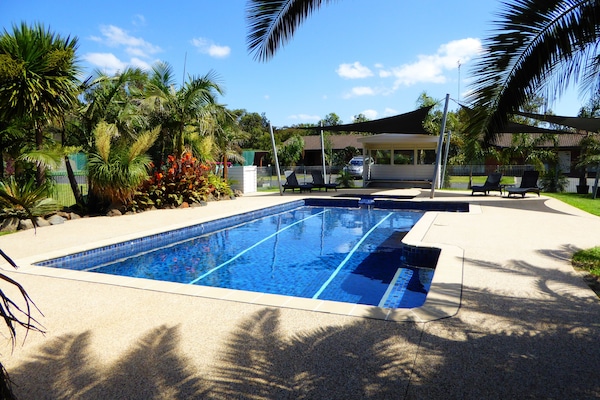 Outdoor pool, pool umbrellas, sun loungers