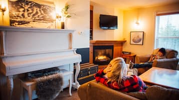 Comfort Condo | Living area | 15-inch TV with digital channels