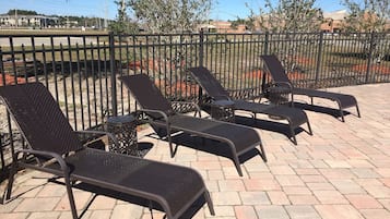 Outdoor pool, open 7 AM to 9:00 PM, pool loungers