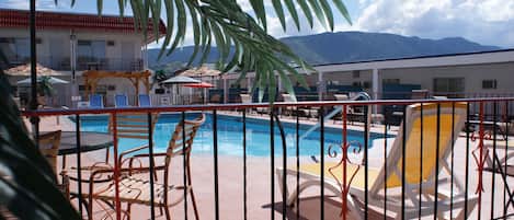 Seasonal outdoor pool, pool umbrellas, pool loungers