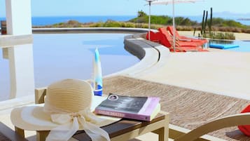 Seasonal outdoor pool, pool umbrellas, pool loungers