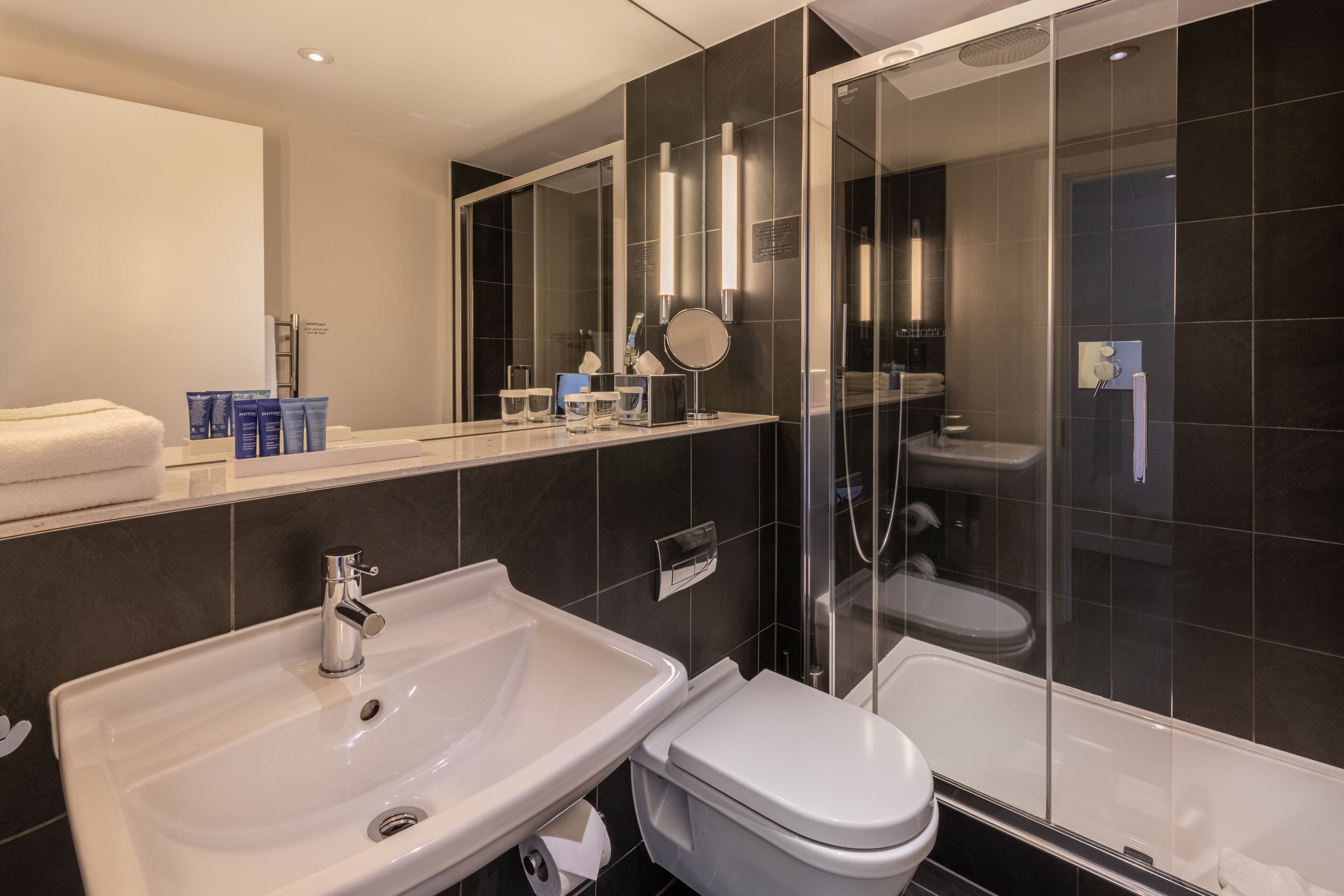 shower, designer toiletries, hair dryer, towels