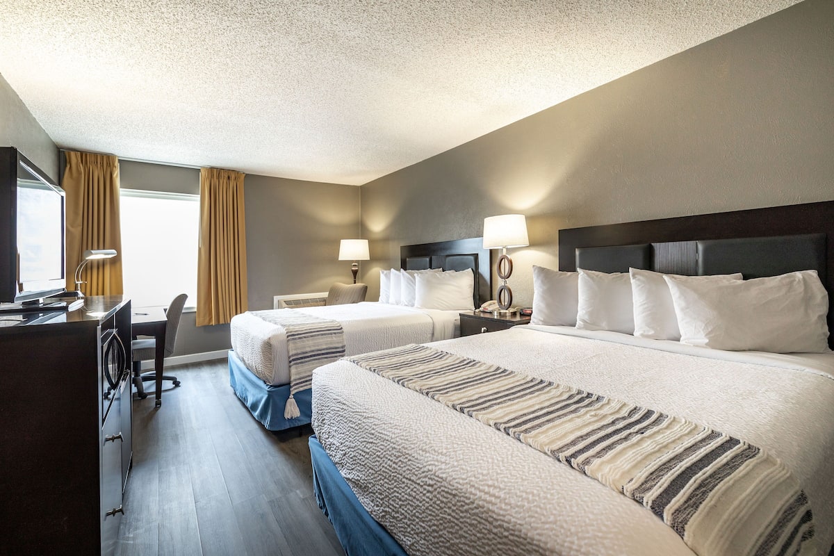 2 bedrooms, premium bedding, laptop workspace, iron/ironing board