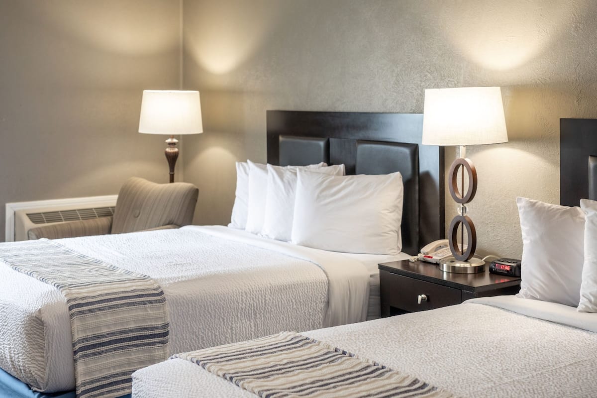 2 bedrooms, premium bedding, laptop workspace, iron/ironing board