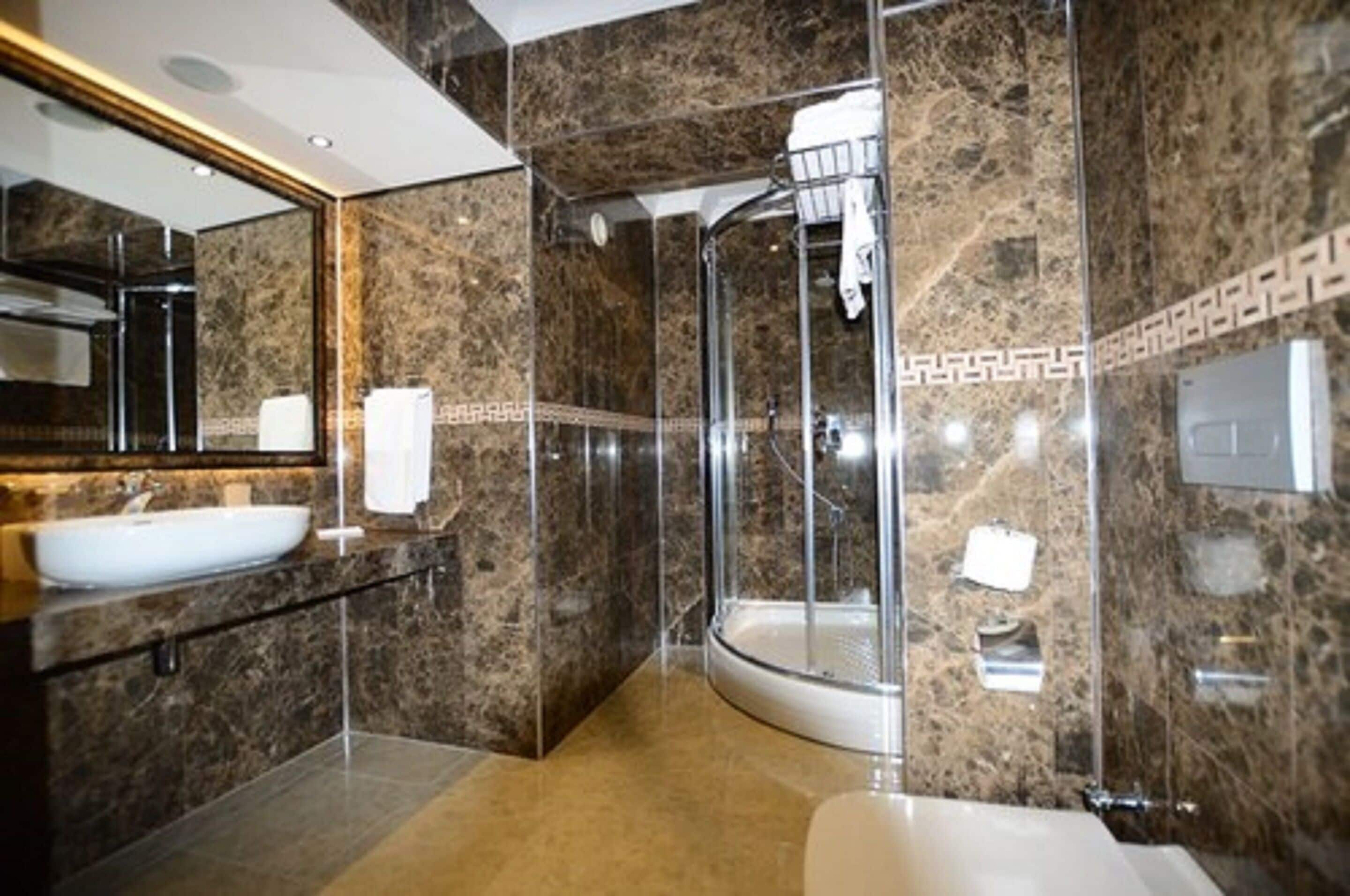 bathtub, hair dryer, slippers, towels