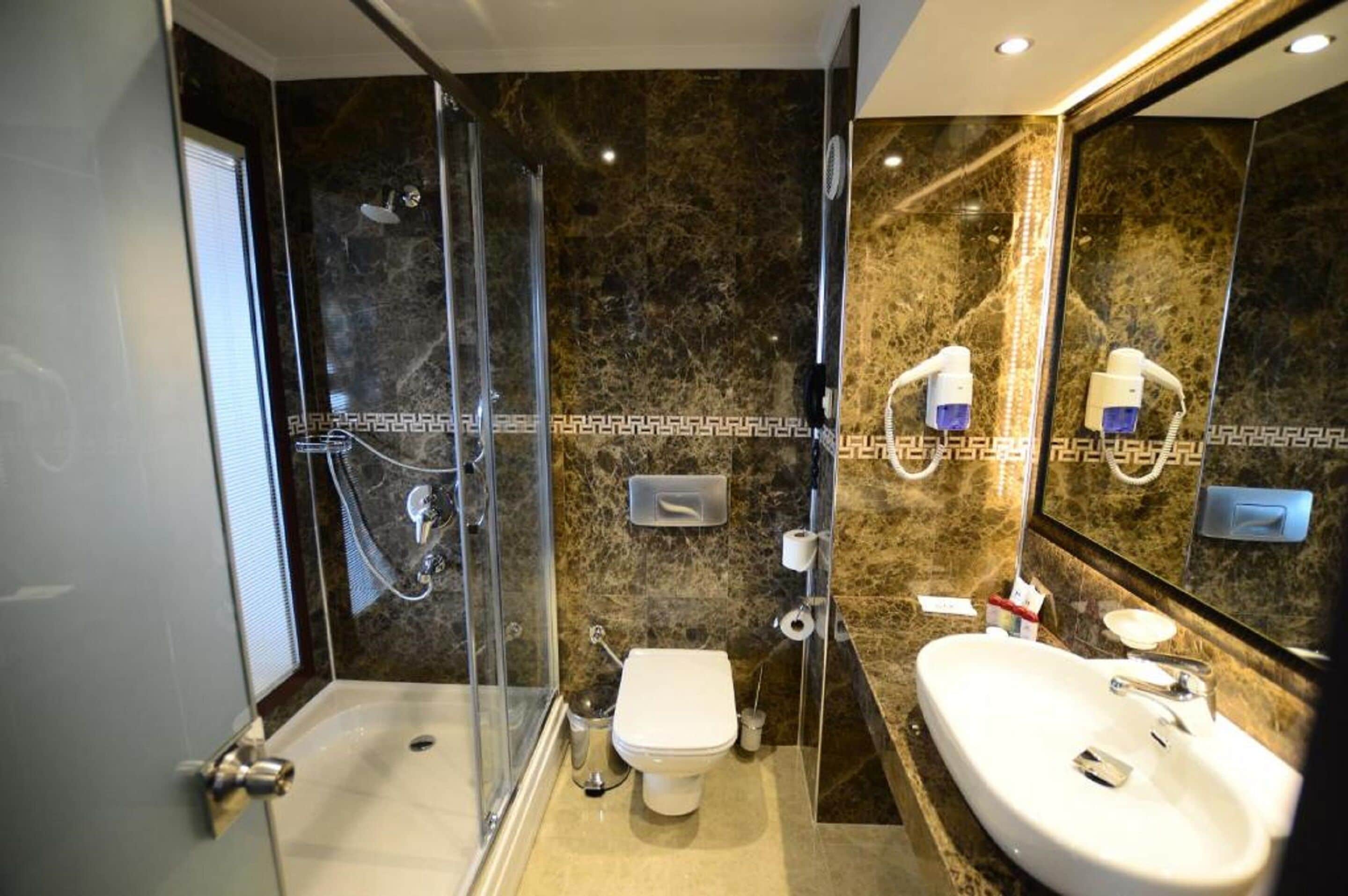 bathtub, hair dryer, slippers, towels