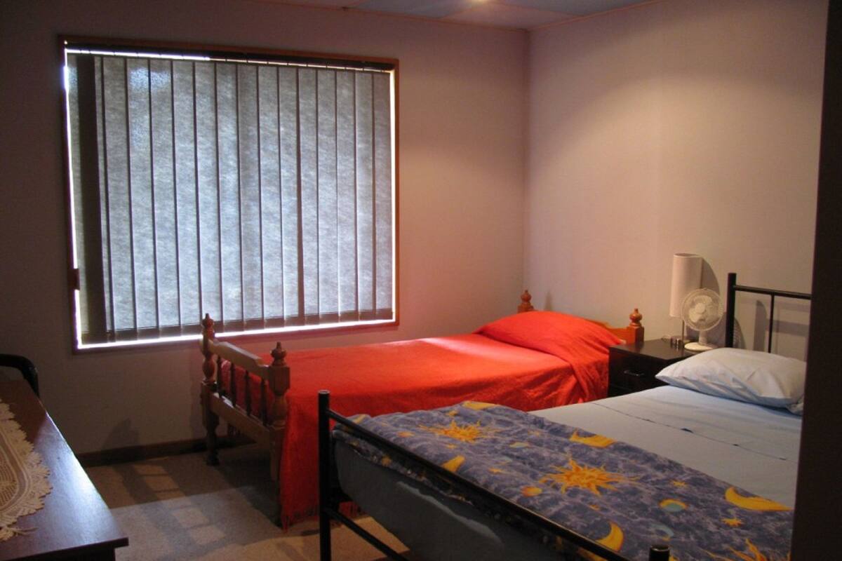 Hypo-allergenic bedding, down duvets, desk, laptop workspace