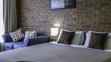 King Suite with River View | Living area | 32-cm flat-screen TV with digital channels, TV