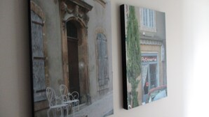 Two framed artworks depicting architectural scenes. - Fat Owl Motel, Bar & Eatery (Piopio)