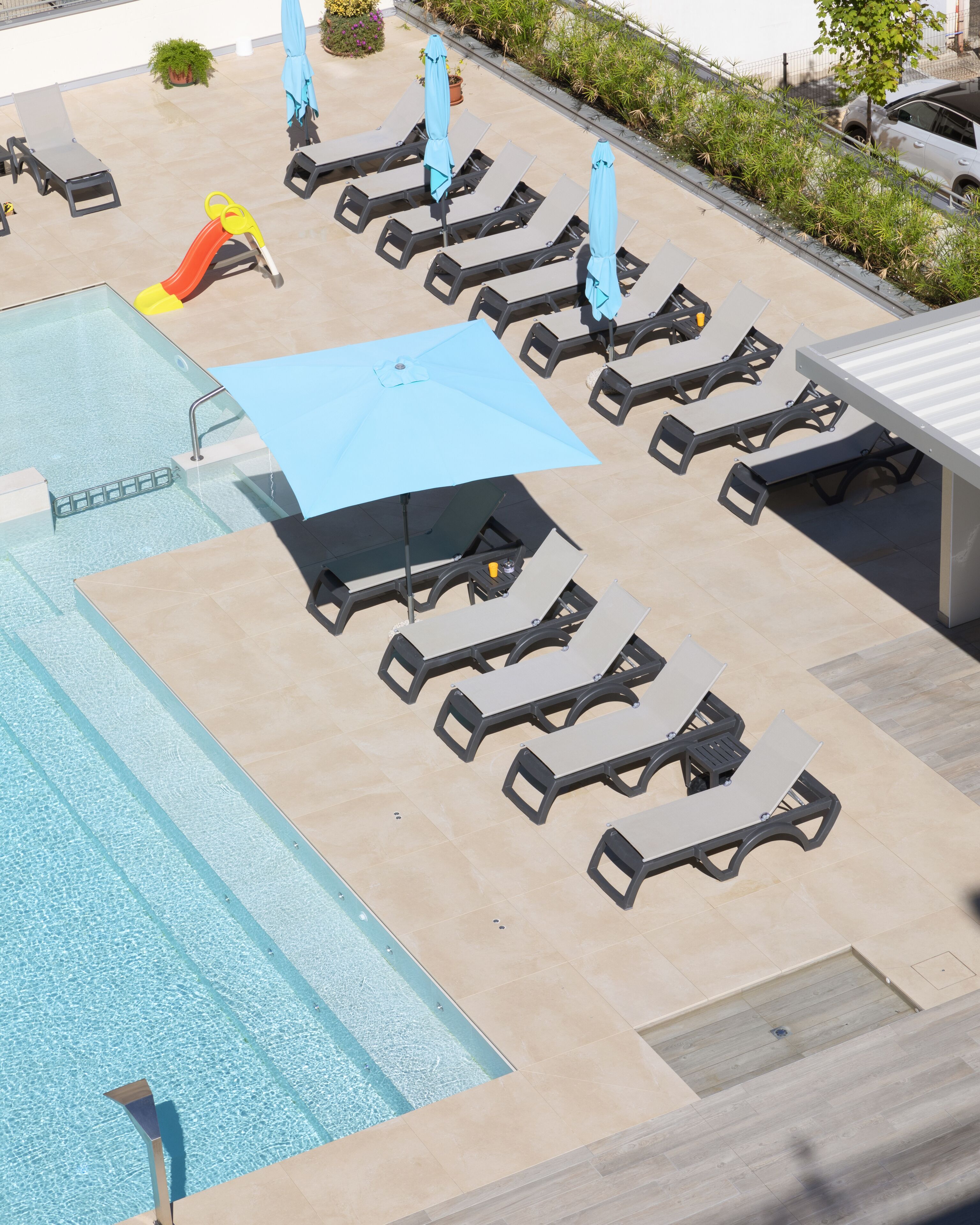 seasonal outdoor pool, pool umbrellas, pool loungers