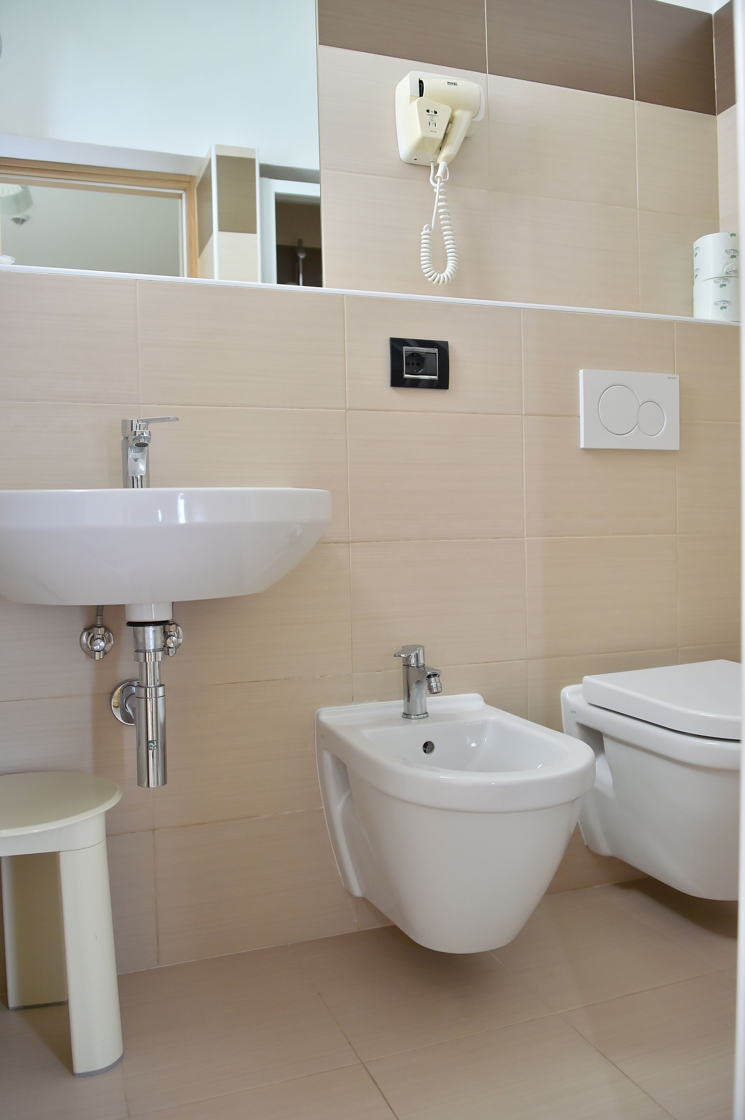 shower, hair dryer, bidet, towels