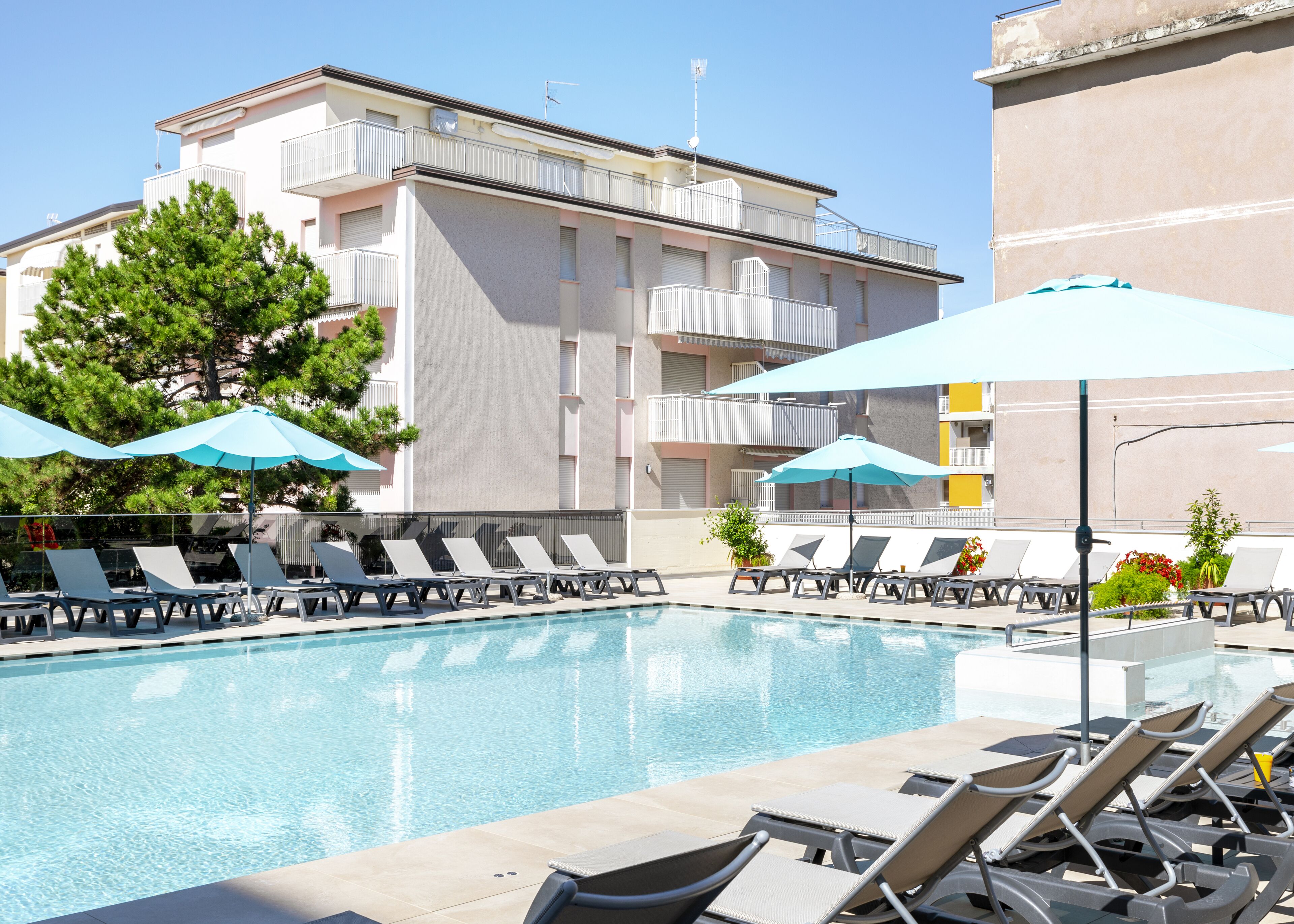 seasonal outdoor pool, pool umbrellas, pool loungers