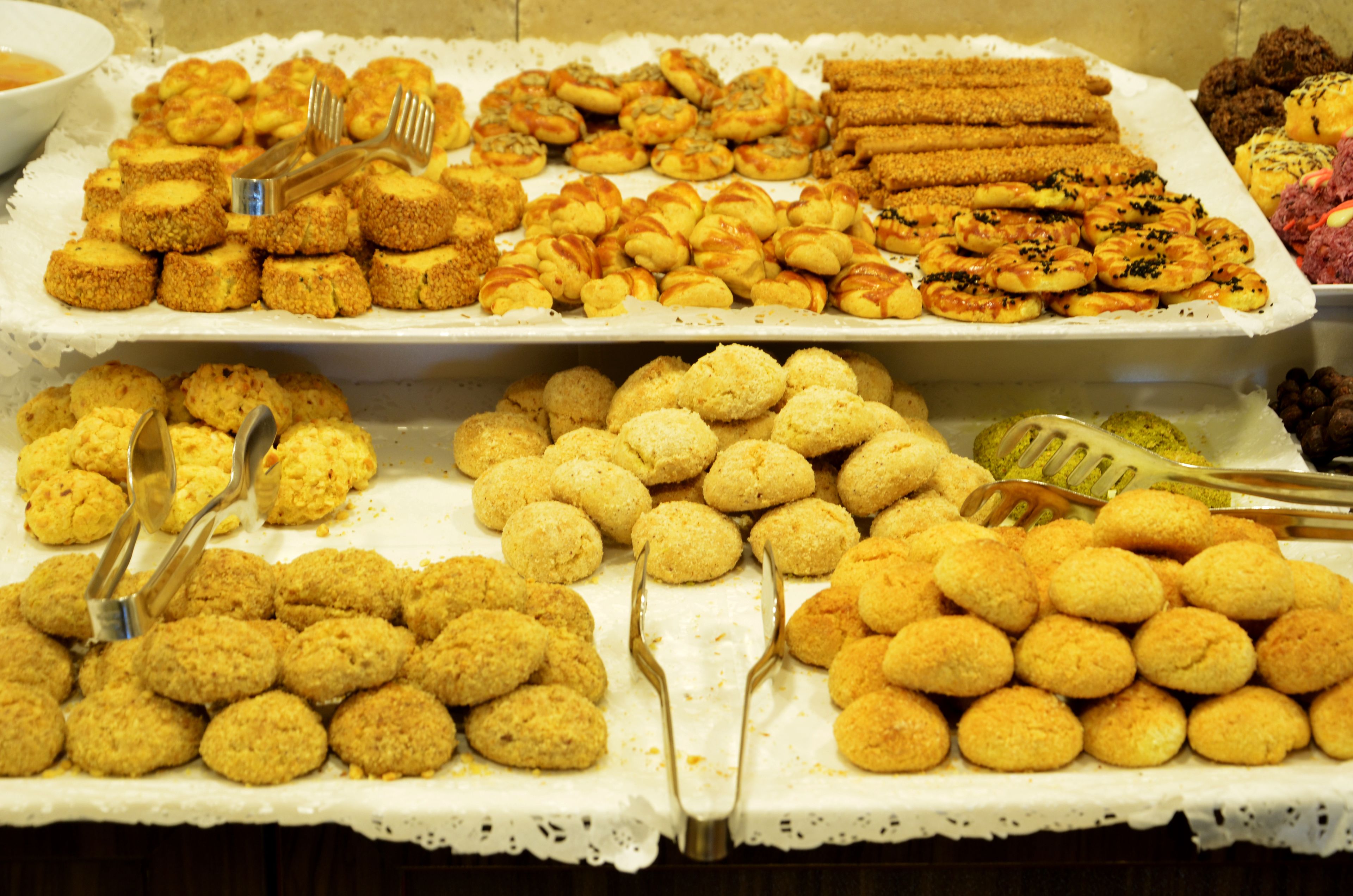A buffet with various food items arranged on trays.