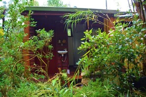 A rustic wooden structure with a small window and a sink. - The Black Cockatoo Nannup (Nannup)