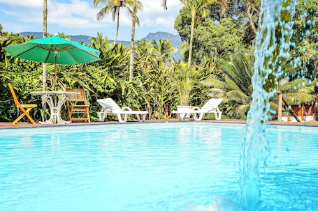 Outdoor pool, pool umbrellas, sun loungers