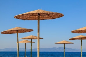 On the beach, sun-loungers, beach umbrellas, beach towels - Natura Park Village (Kos)