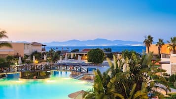 Indoor pool, outdoor pool, pool umbrellas, pool loungers