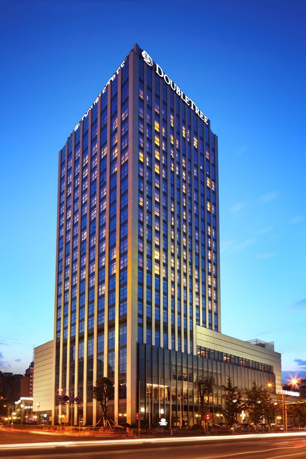 A high-rise hotel with a prominent "DOUBLETREE" sign at the top. - Doubletree by Hilton Chongqing Wanzhou (Chongqing)