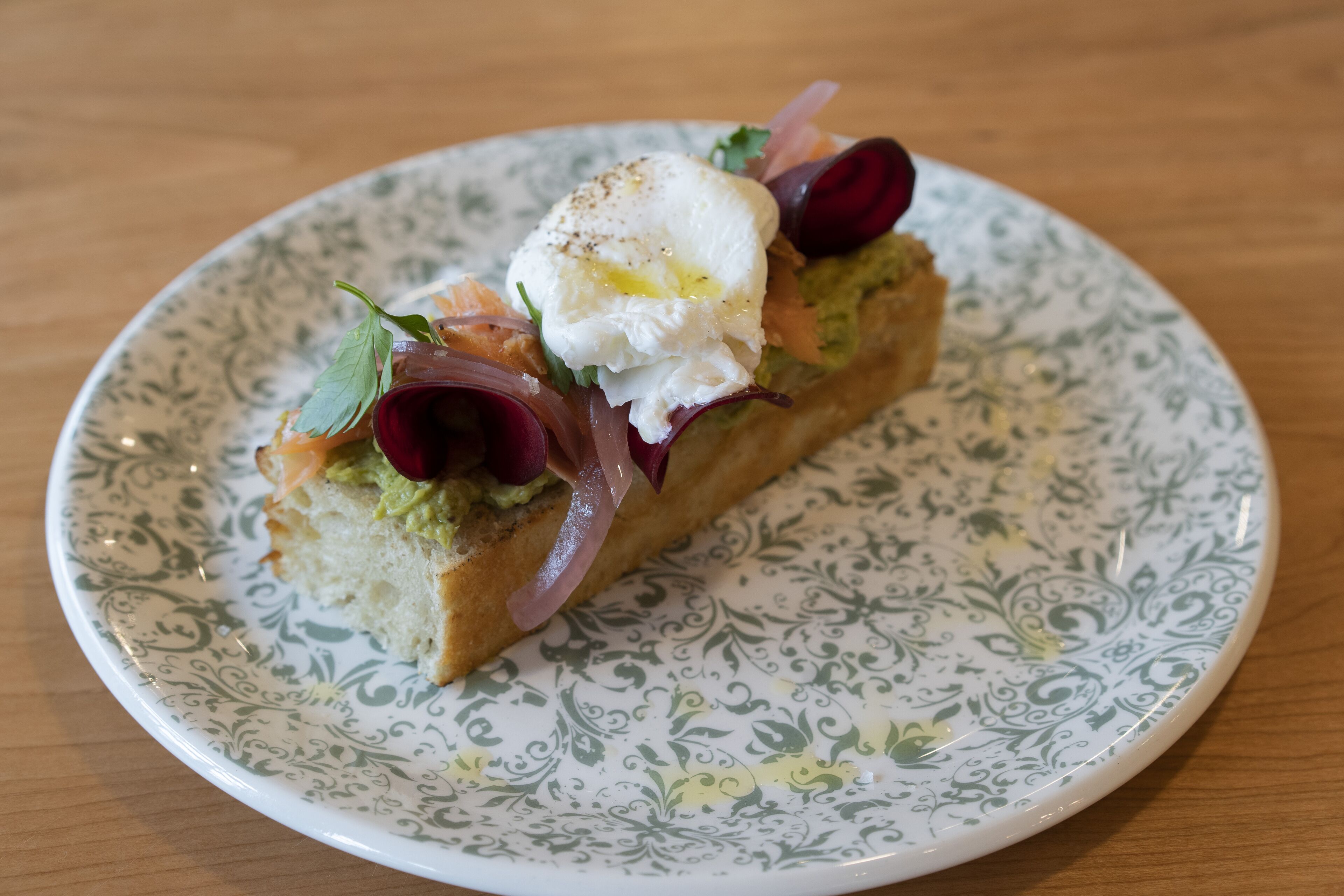 A slice of sandwich on a plate.