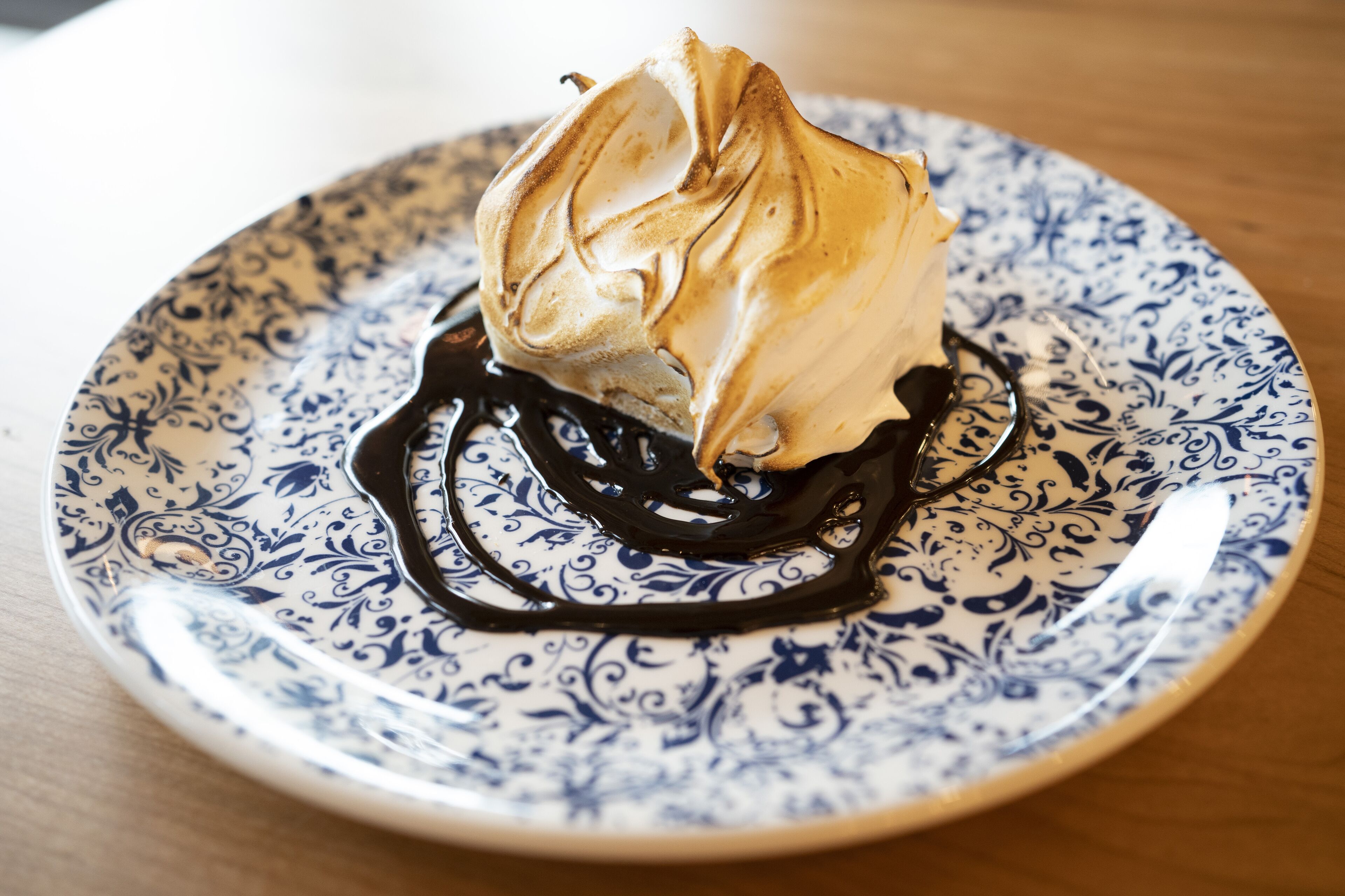A dessert on a patterned plate.