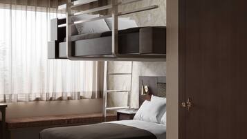 A modern bedroom with a bunk bed, a bedside table, a lamp, and a large window with sheer curtains.