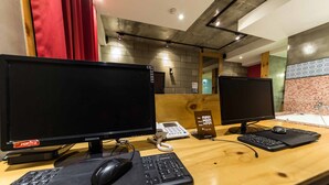 A hotel reception desk with two monitors, a telephone, a keyboard, and a mouse. - Hotel Yaja Yeongdeungpo (Seoul)