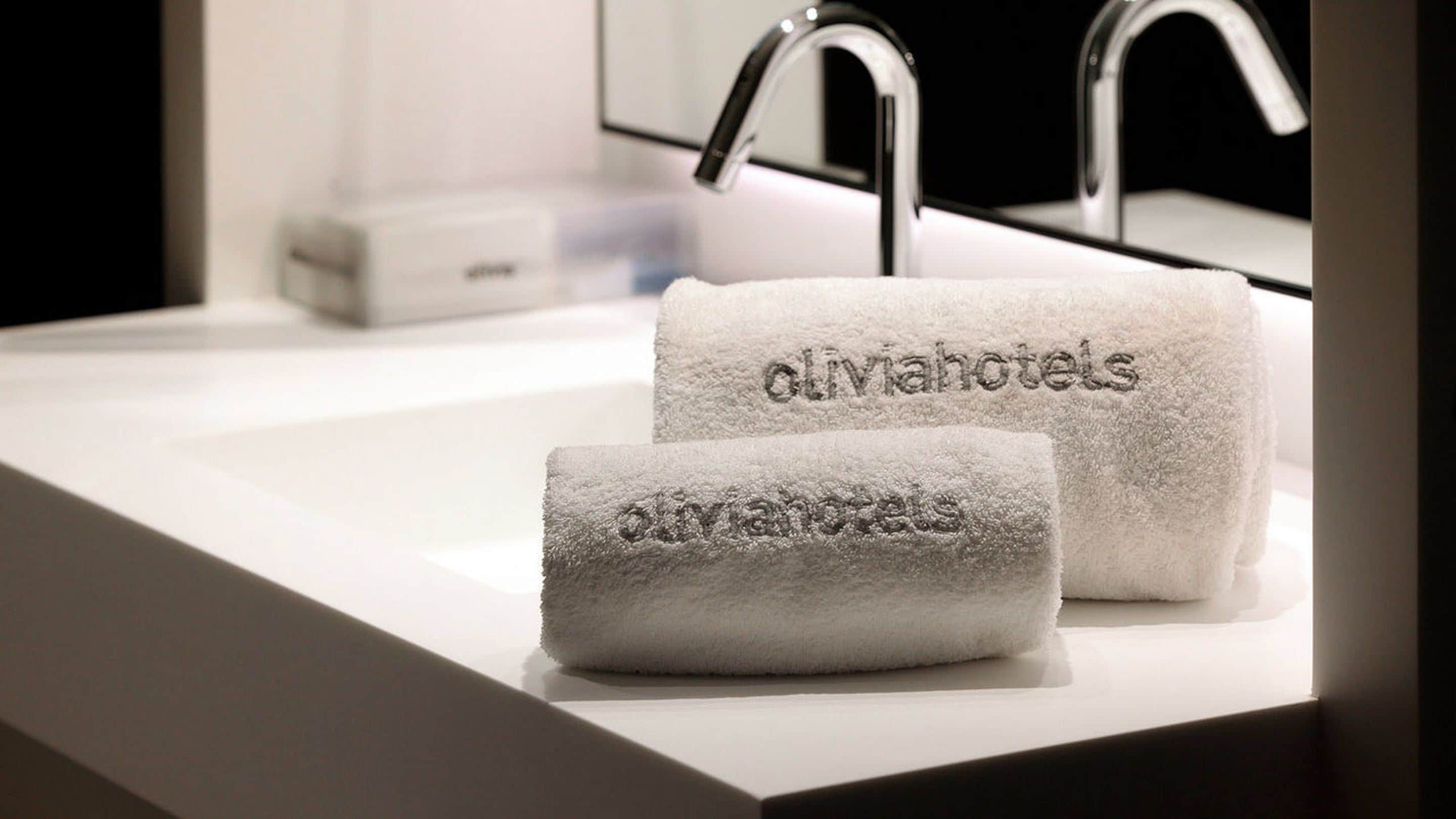 eco-friendly toiletries, hair dryer, towels