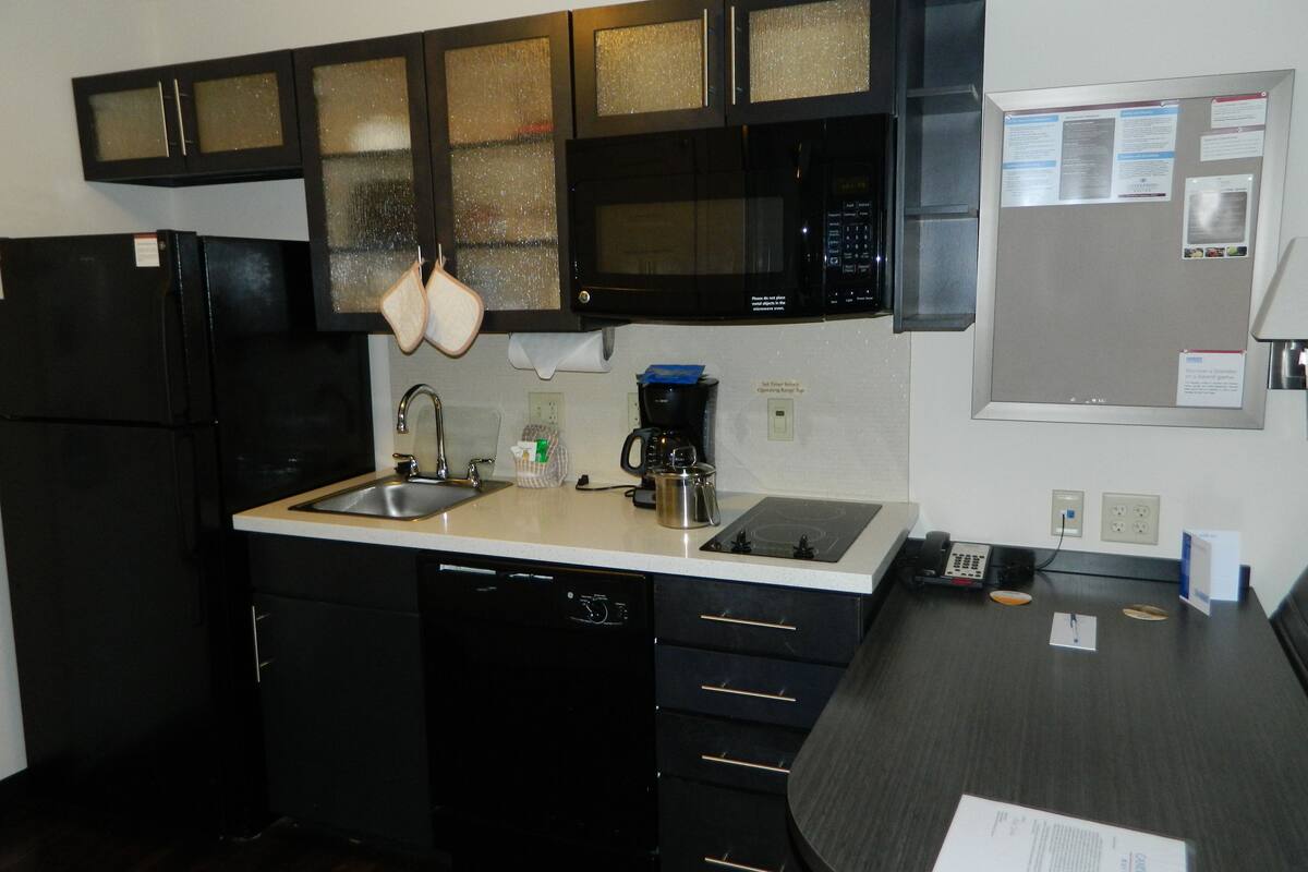 full-sized fridge, microwave, stovetop, dishwasher